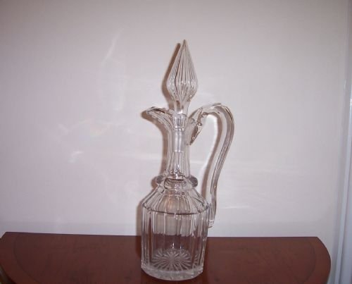 an early 19th century cut glass claret jug