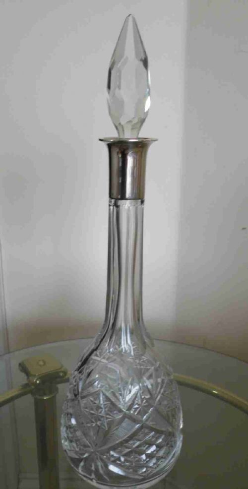 a good elegant late 19th century silver mounted cut glass decanter