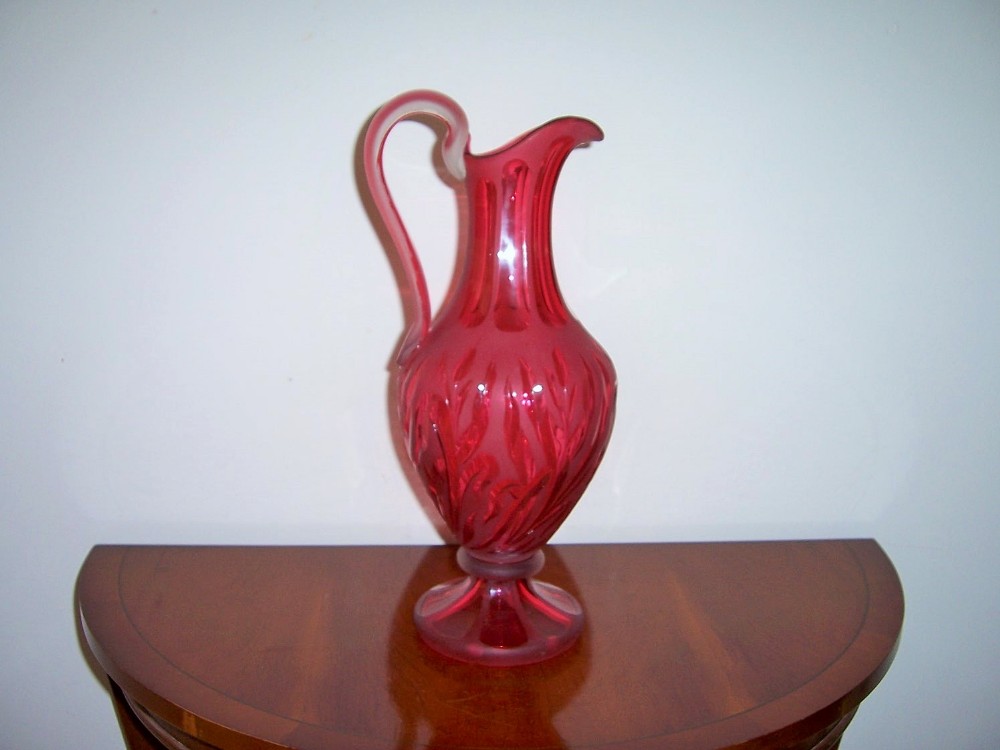 a superb large antique 19th century cranberry glass champagne jug