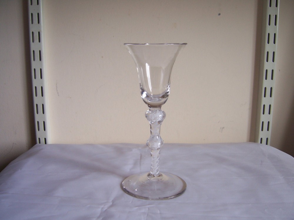 an 18th century double knop opaque twist stem wine glass circa 1760