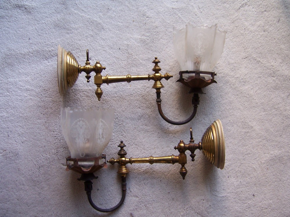 an original pair of victorian wall mounted brass gas lamps and shades