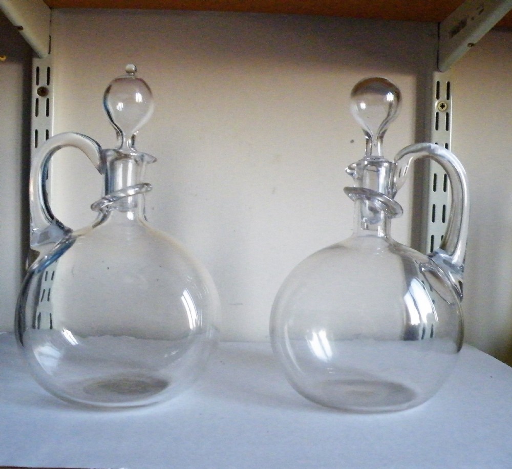 a fine and rare pair of victorian glass claret jugs with neck drip rings