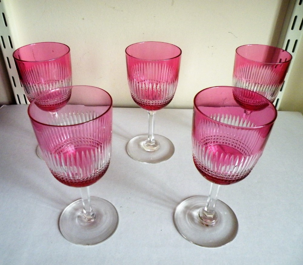a set of 5 victorian cranberry cut to clear wine glasses