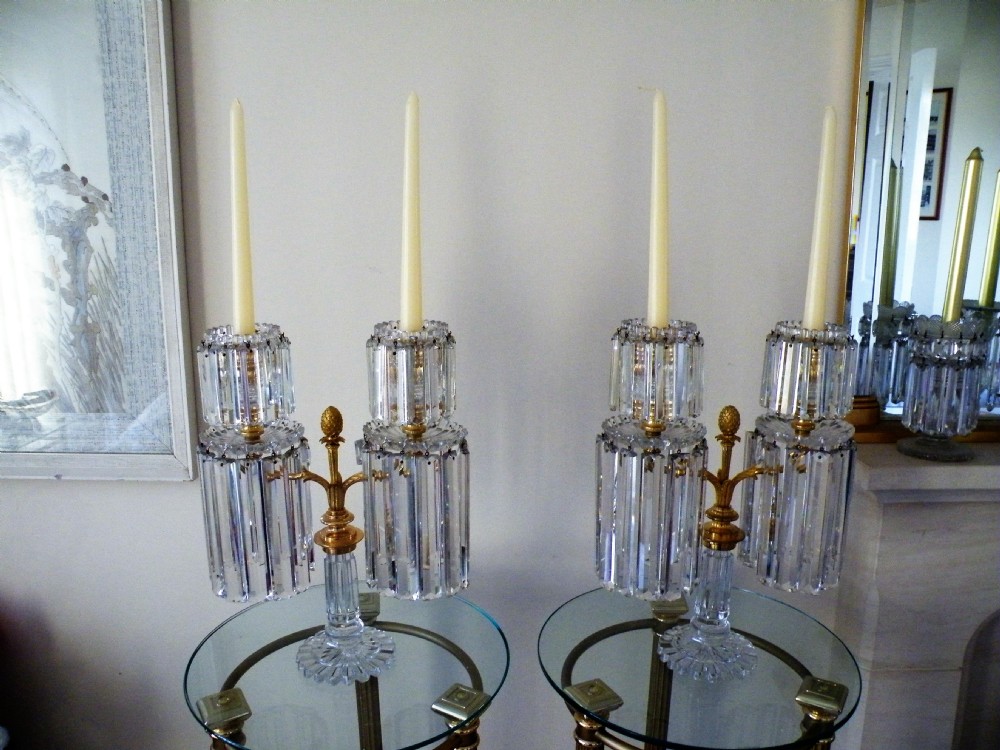 an exceptional pair of regency glass and ormolu two light candelabra