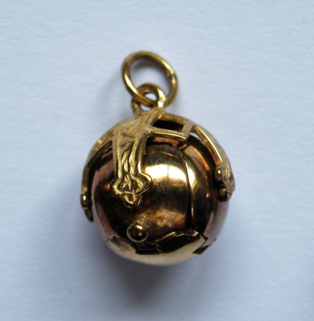 a good vintage gold and silver masonic ball fob charm
