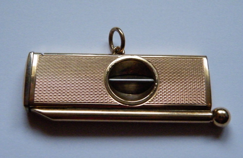 a quality vintage 9 carat rose gold cigar cutter and piercer jewellery watch chain fob