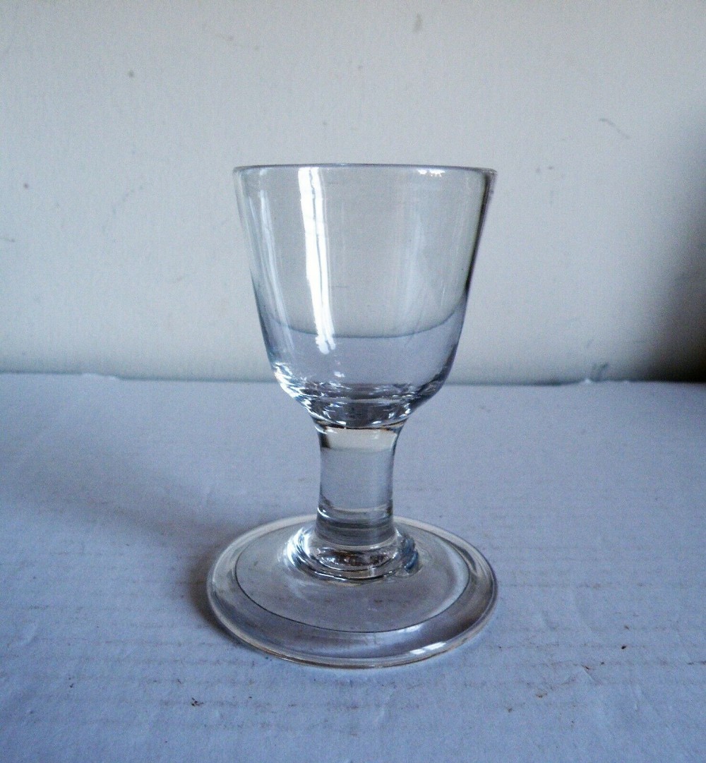 an 18th century firing toastmasters wine glass