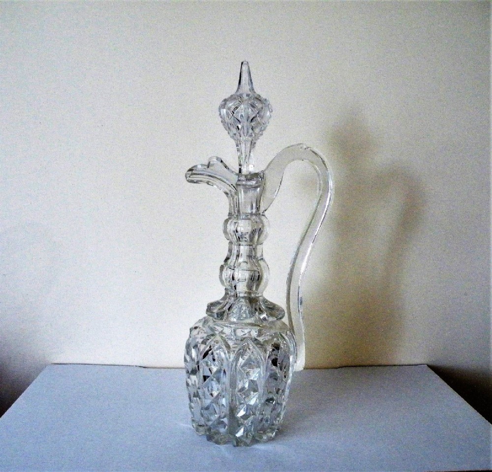 a 19th century exhibition quality large heavily cut glass claret jug