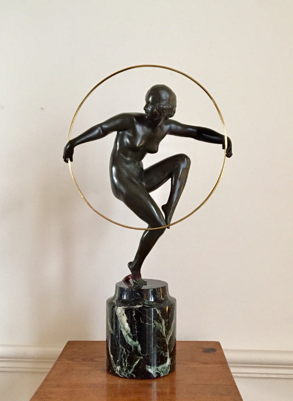 a good art deco bronze figure of the nude hoop dancer by andre marcel bouraine