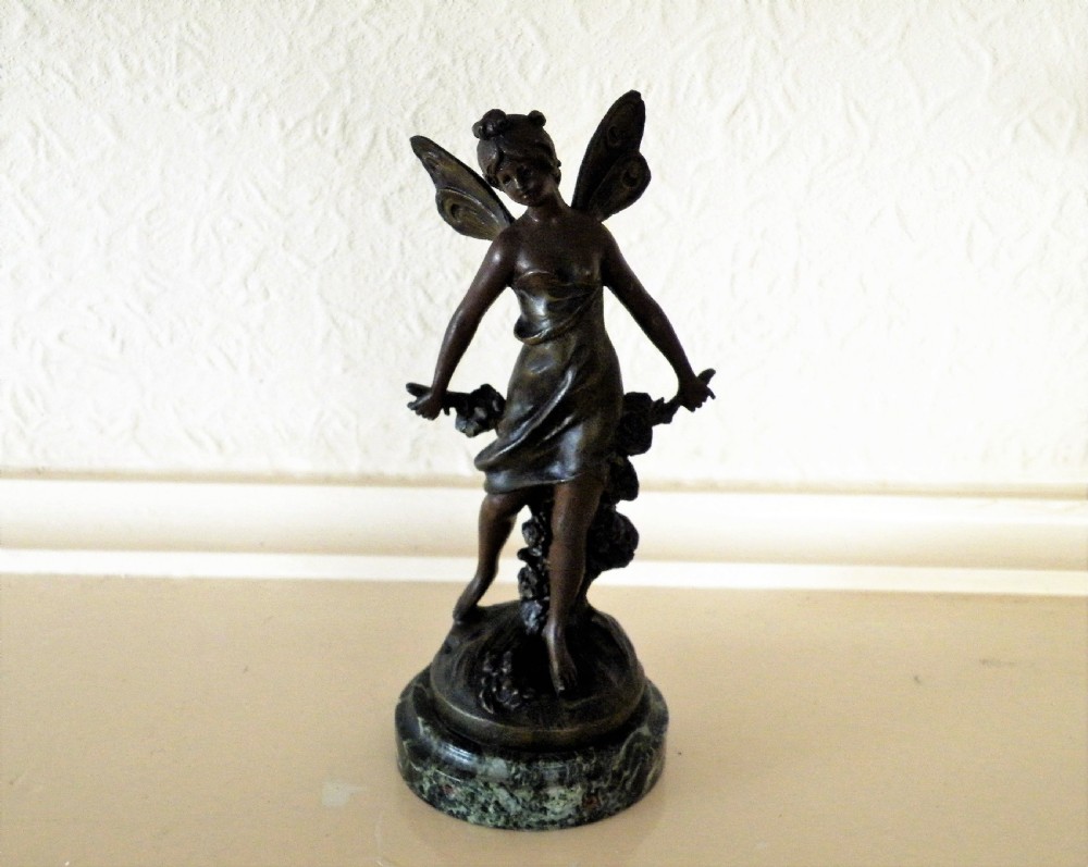 a nice figure of a bronze fairy marked aug moreau