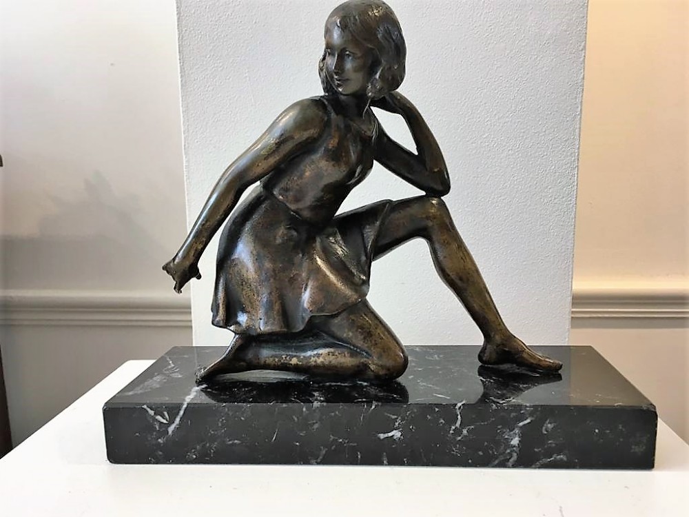 a good art deco bronze figure of a kneeling girl geo maxim