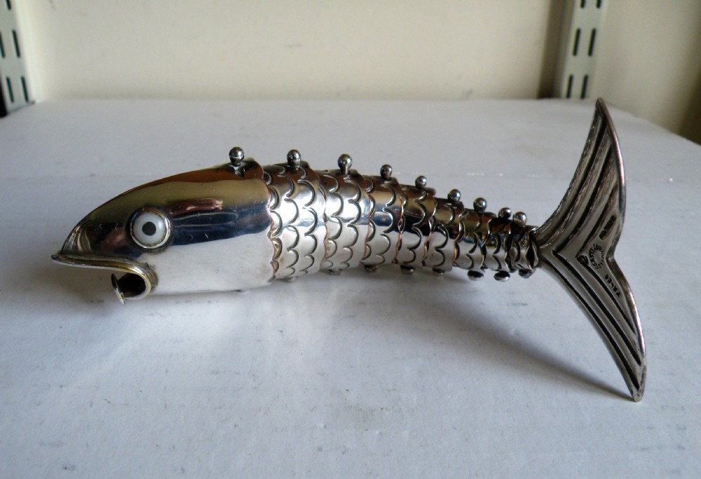 an unusual large vintage silver plate articulated fish bottle opener