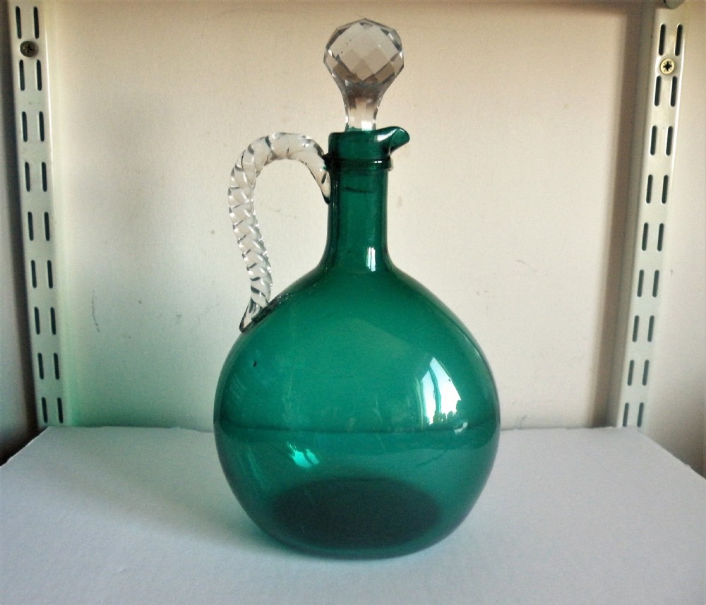 an antique 19th century green glass claret jug flagon