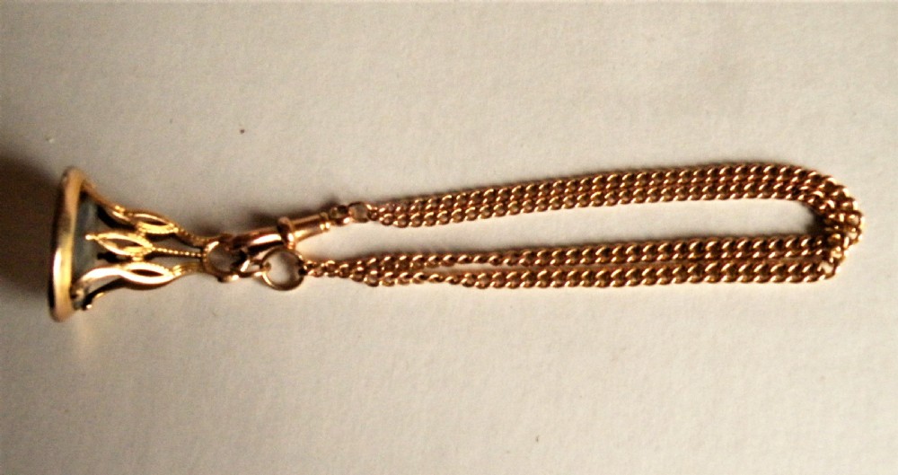 an early 19th century gold seal and rose gold bracelet