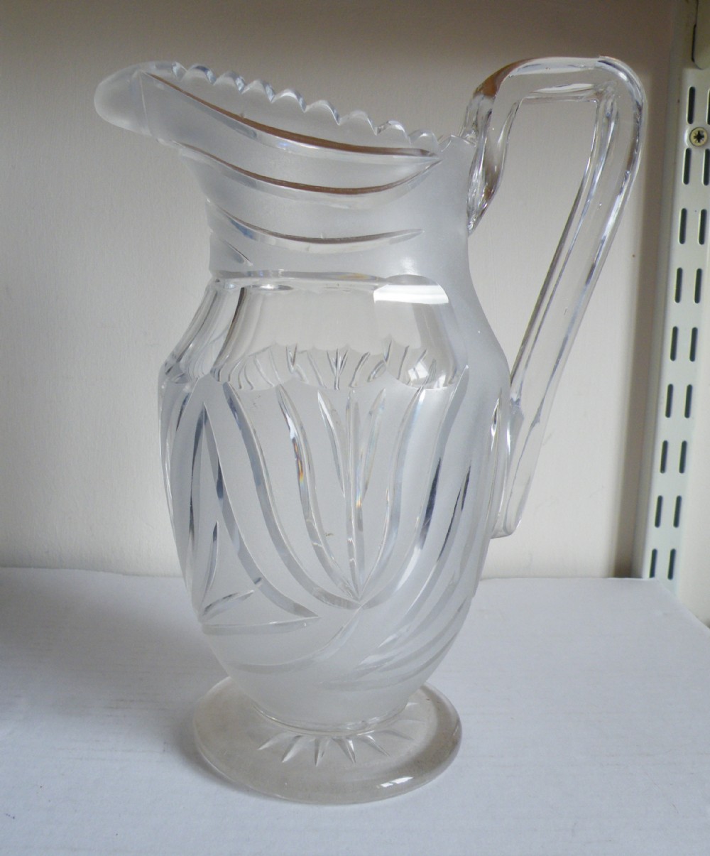 a large and heavy victorian cut and frosted water jug