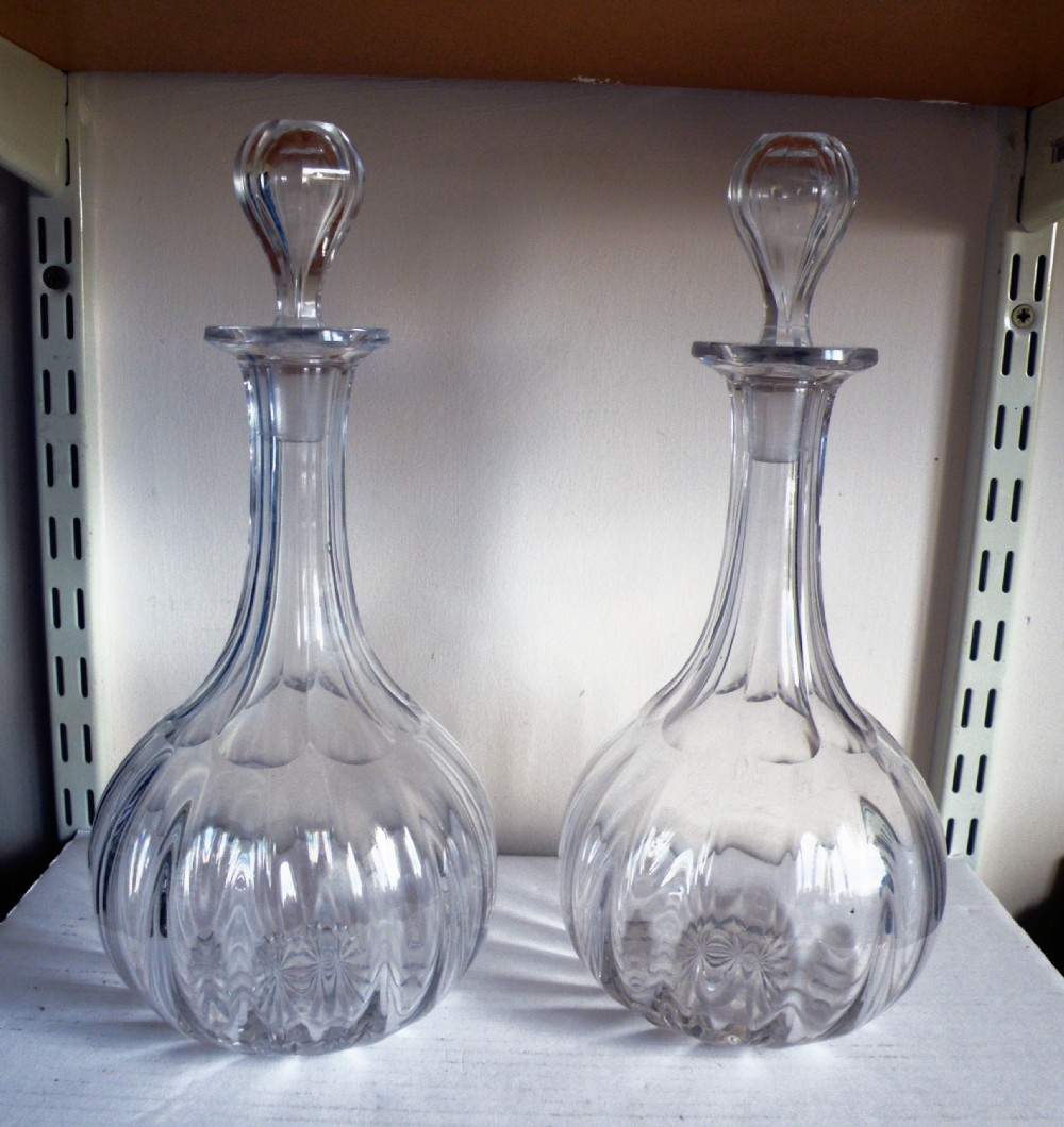 a pair of victorian shaft and globe decanters