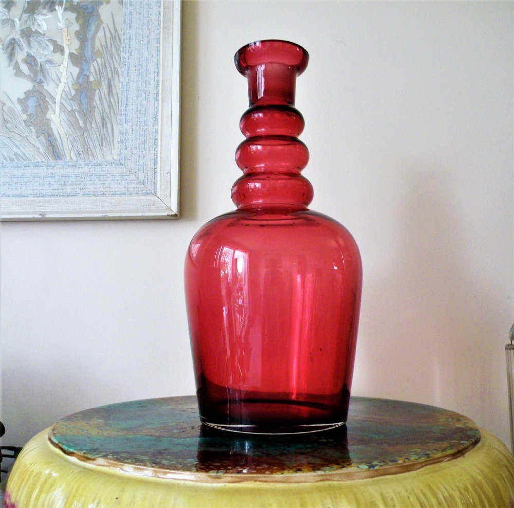 an enormous edwardian cranberry glass serving bottle holds 3 litres