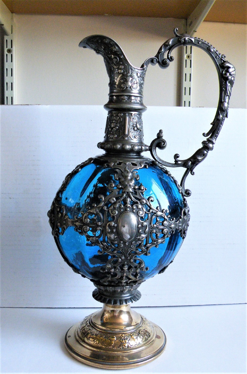 a 19th century bohemian blue glass and silver plated claret jug