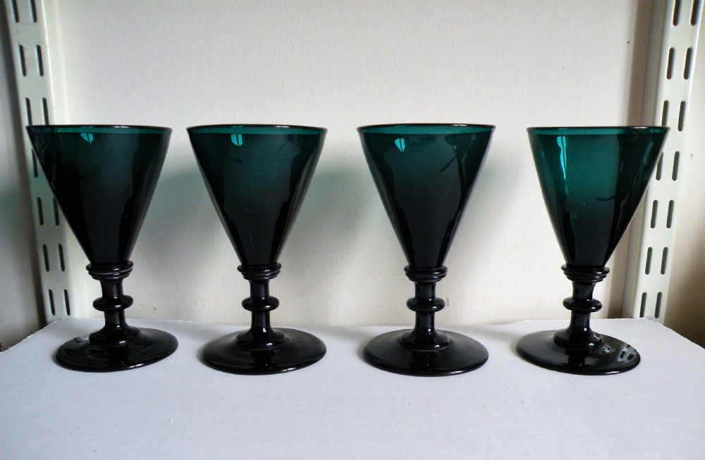 a good set of four 18th century bristol green wine glasses