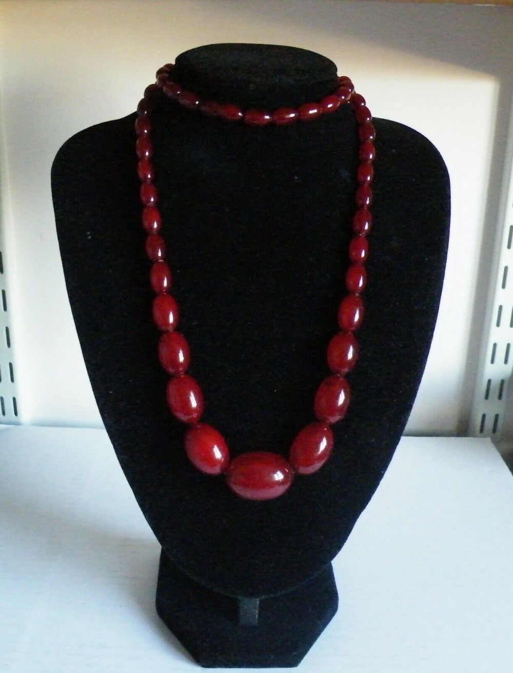 an antique art deco cherry amber bead necklace