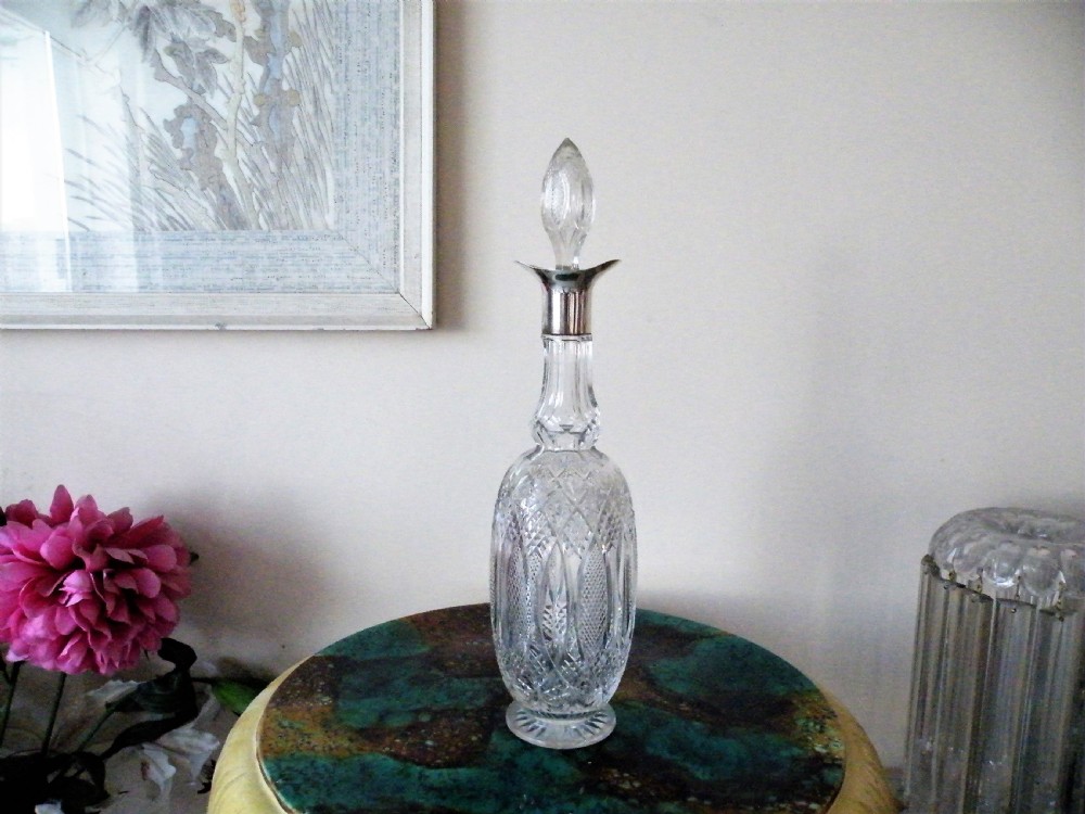 a tall elegant edward vii silver mounted cut glass decanter 1901