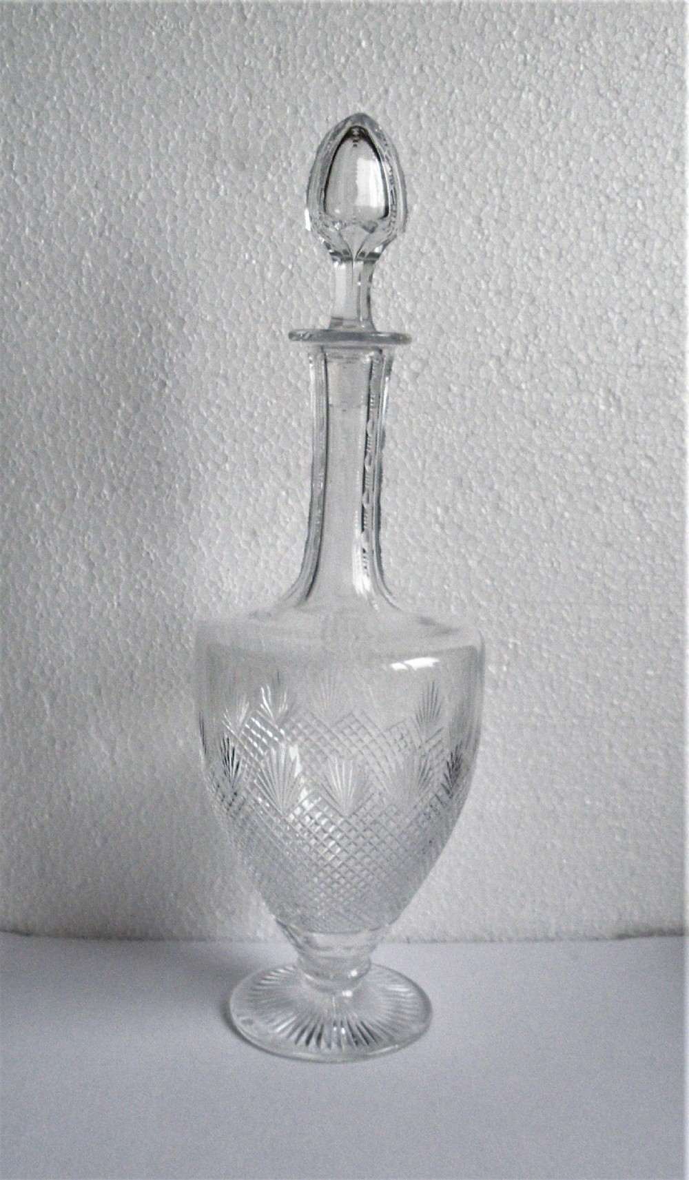a tall elegant edwardian cut glass decanter in the classical shape