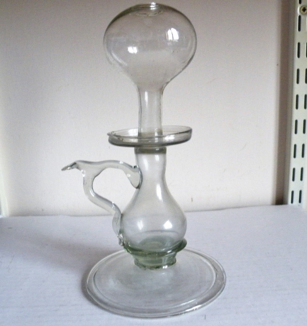 a tall 18th century glass lace makers lamp