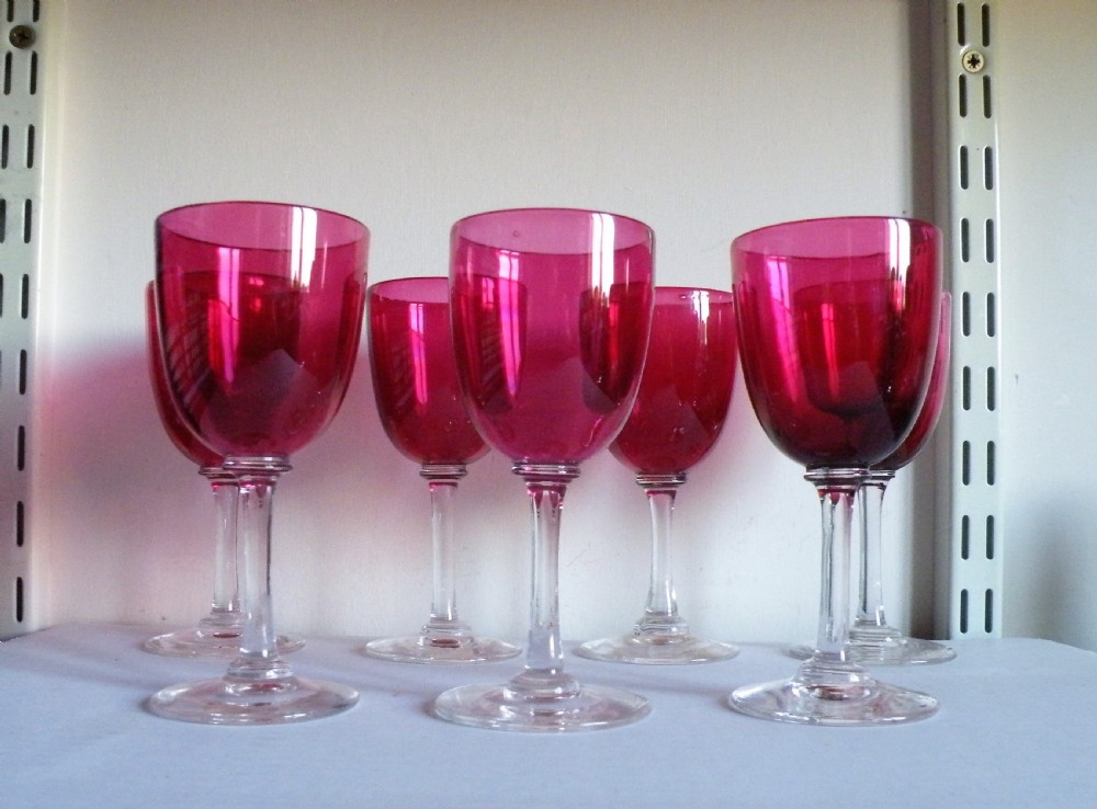 a set of seven victorian cranberry bowl wine glasses