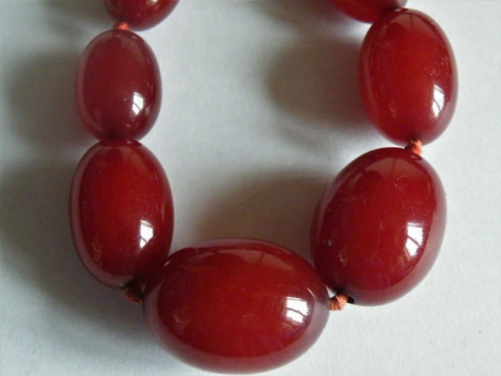 a good art deco cherry amber bakelite bead necklace