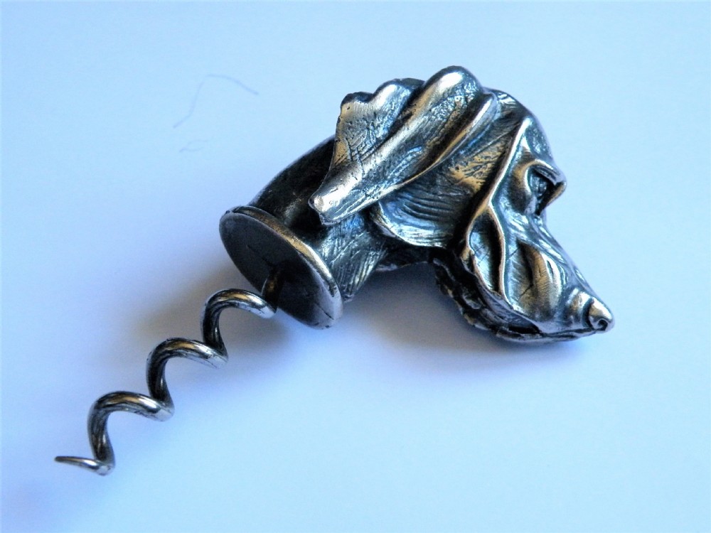 a silver plated blood hound dogs head corkscrew
