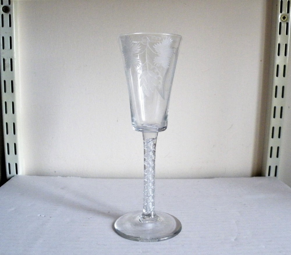 a good 18th century engraved tall ale glass with air twist stem