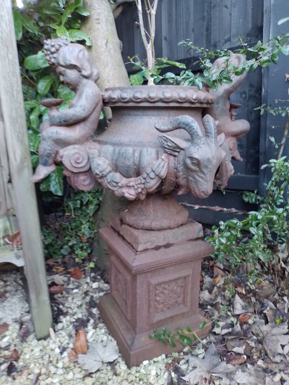 a wonderful 19th century cast iron garden urn and pedestal base