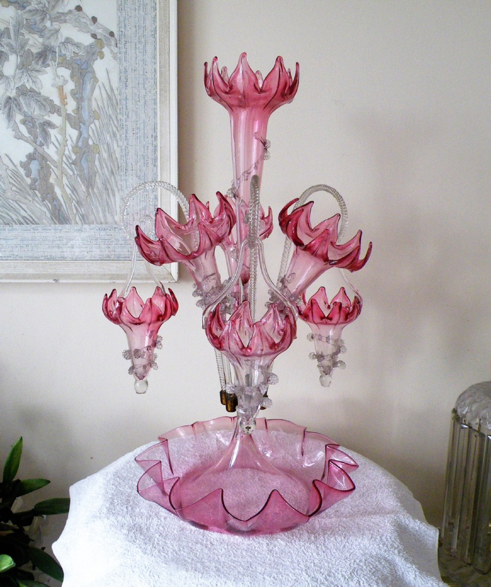 a stunning genuine victorian cranberry glass epergne with hanging baskets circa 1870