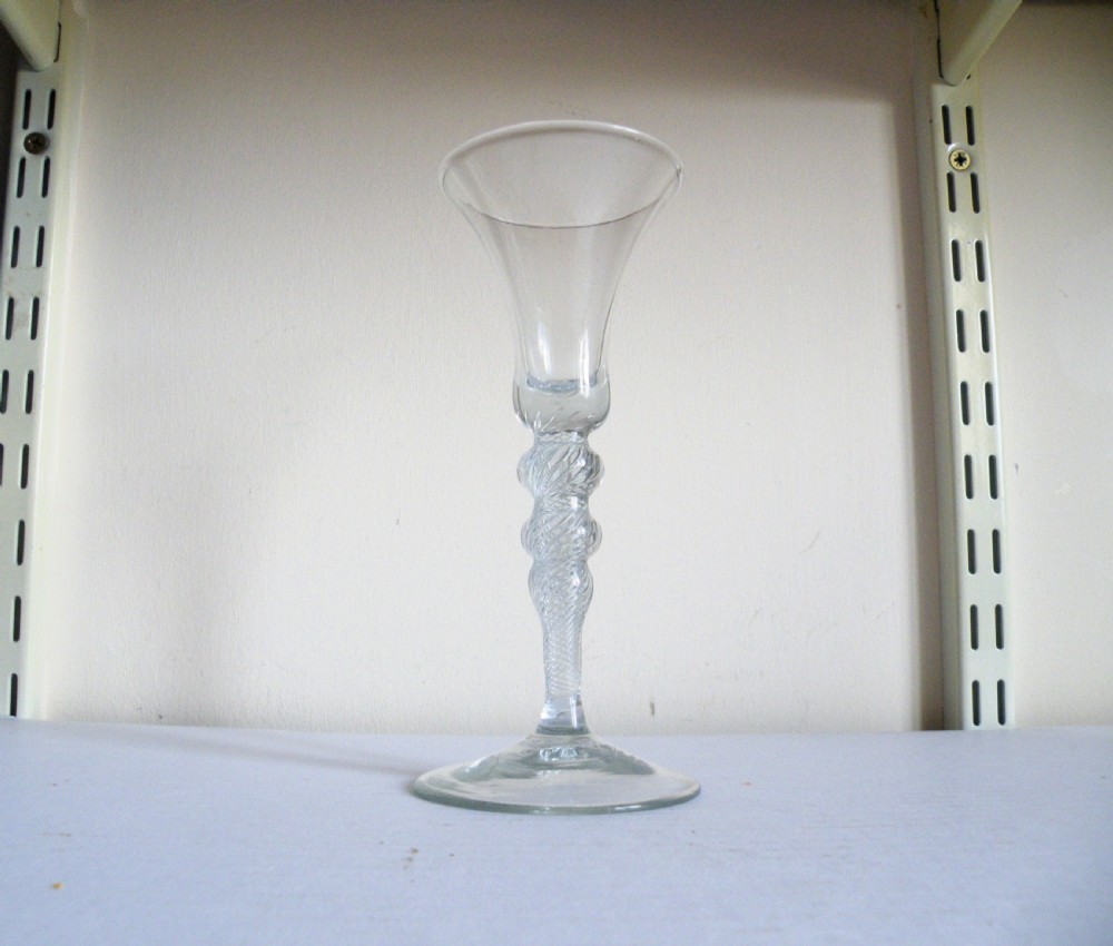 a tall 18th century knopped air twist stem wine glass circa 1745