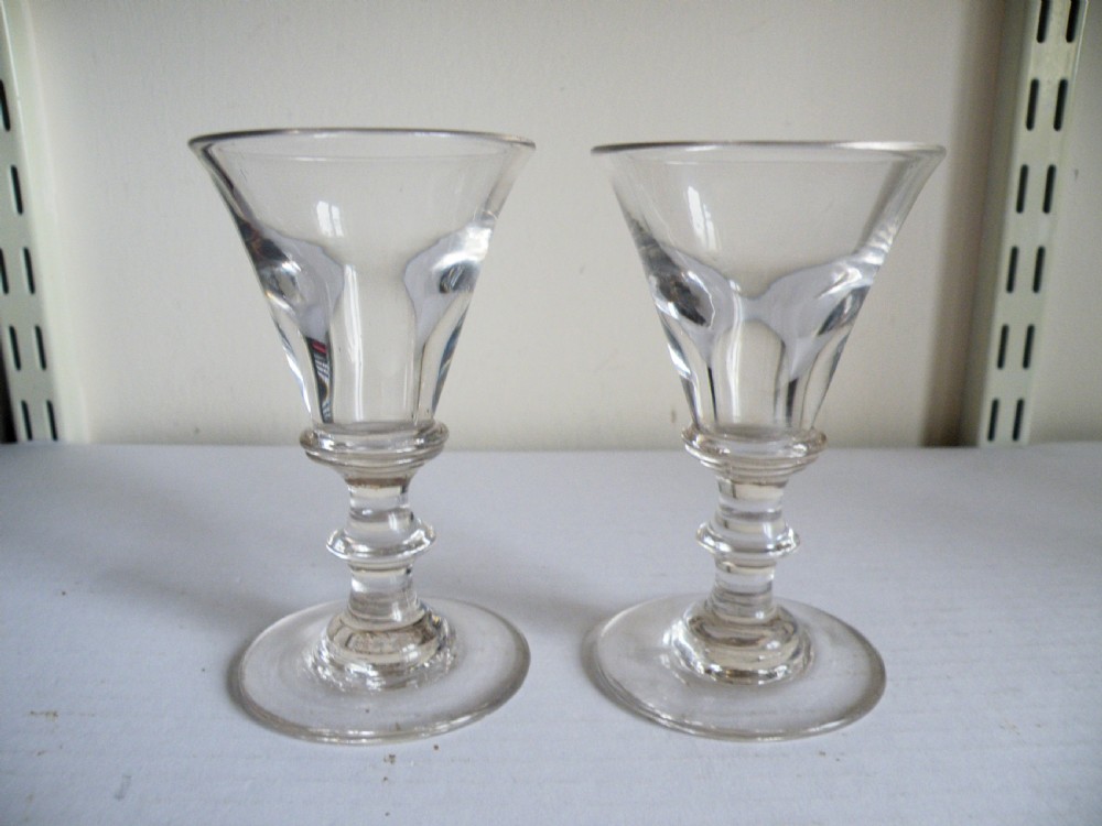 a nice pair of georgian deceptive toastmasters wine glasses