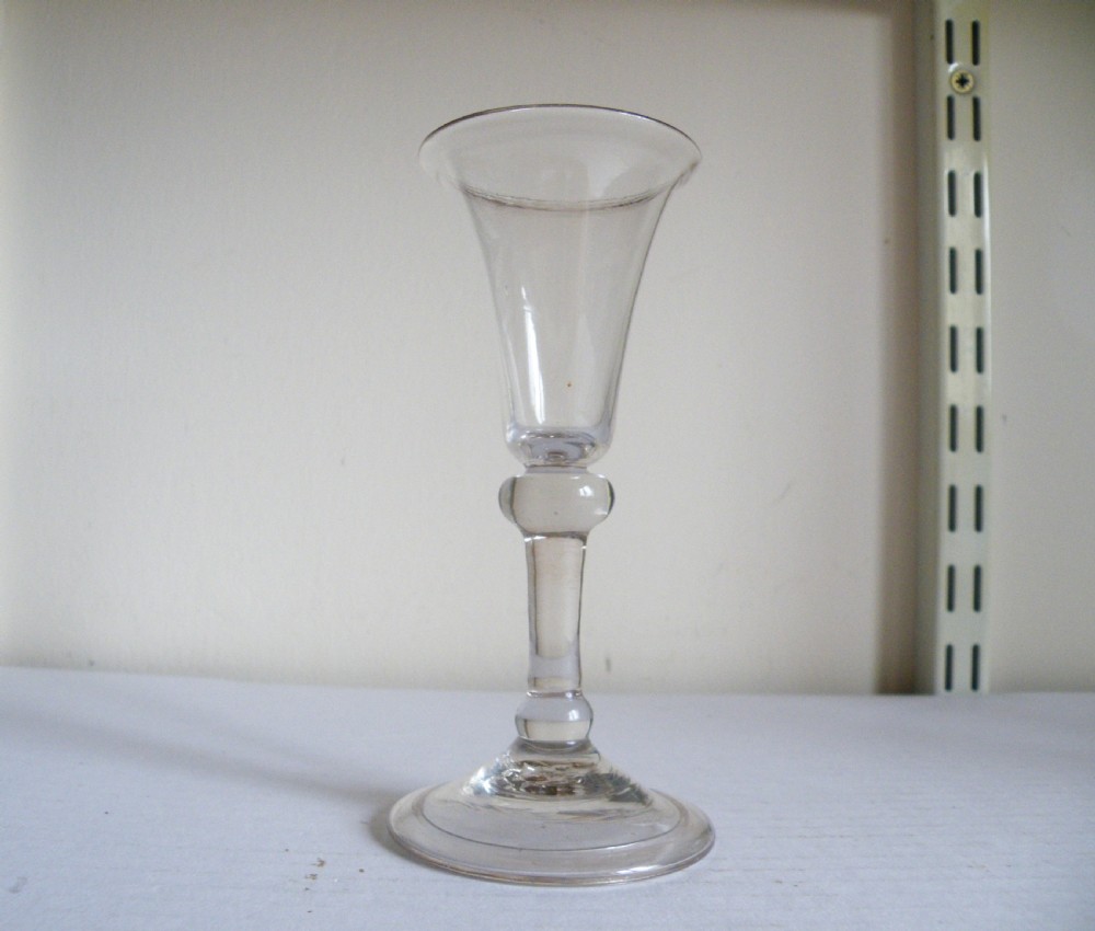an early 18th century balustroid stem gin glass