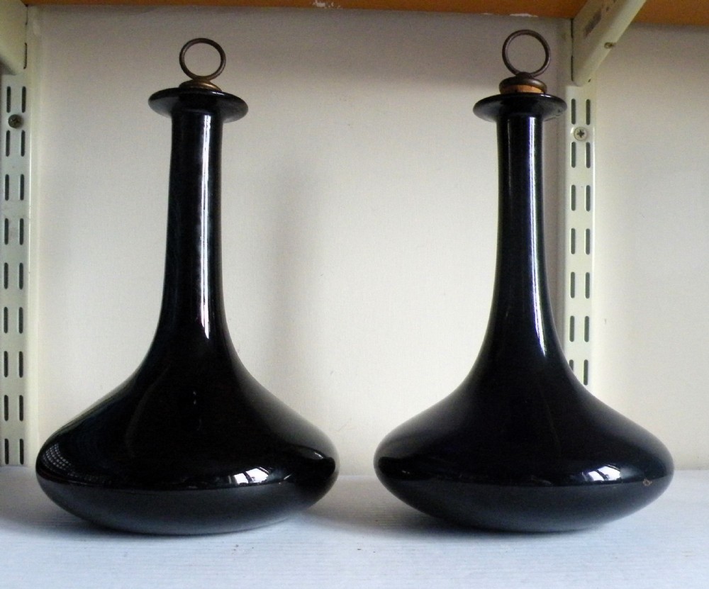 a pair of early 19th century bristol blue glass ships decanters