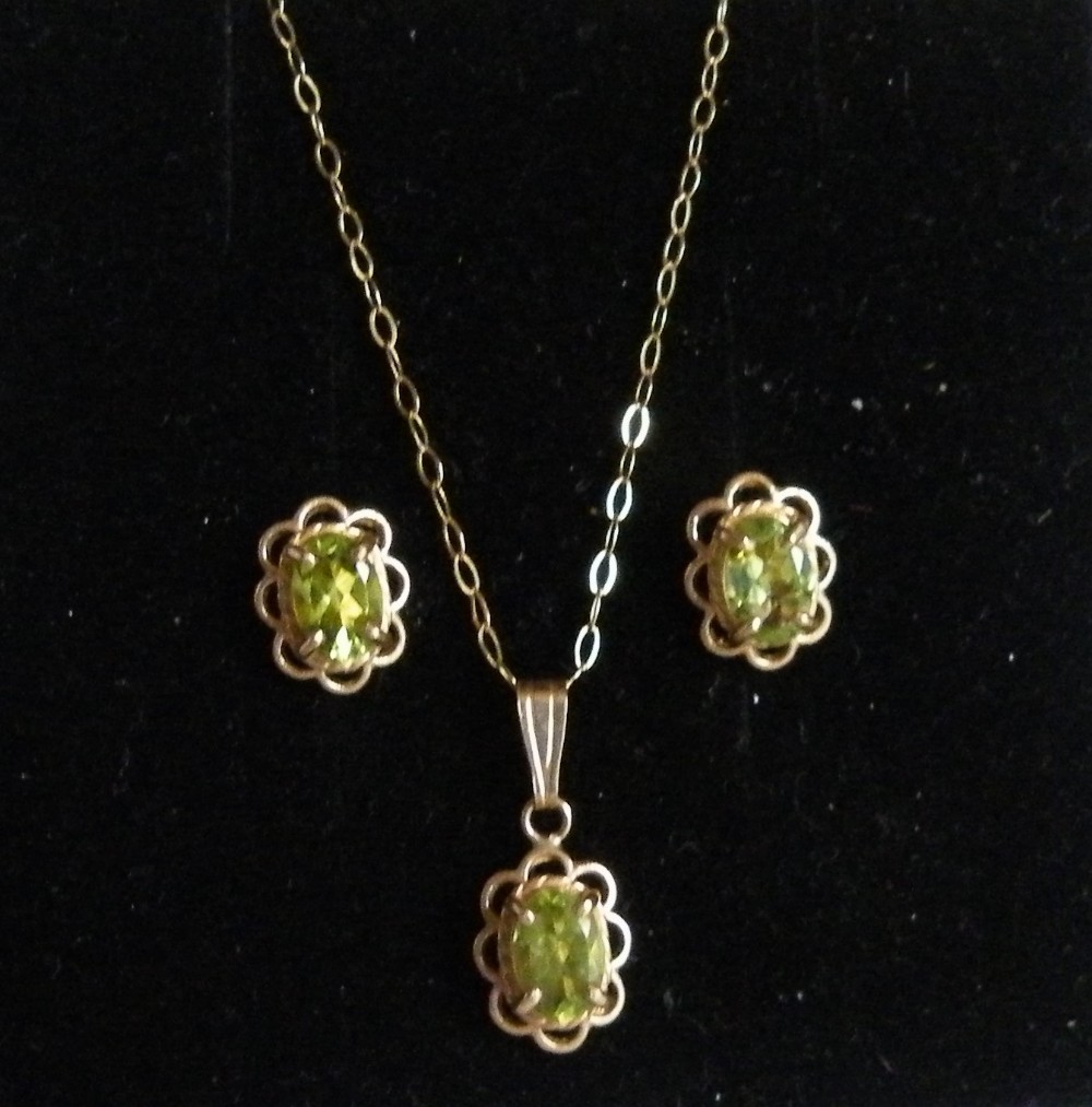 a nice edwardian gold and peridot earrings and necklace suite