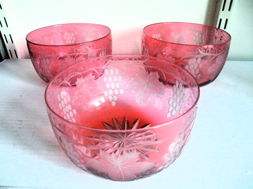 a nice set of 3 victorian engraved cranberry glass bowls