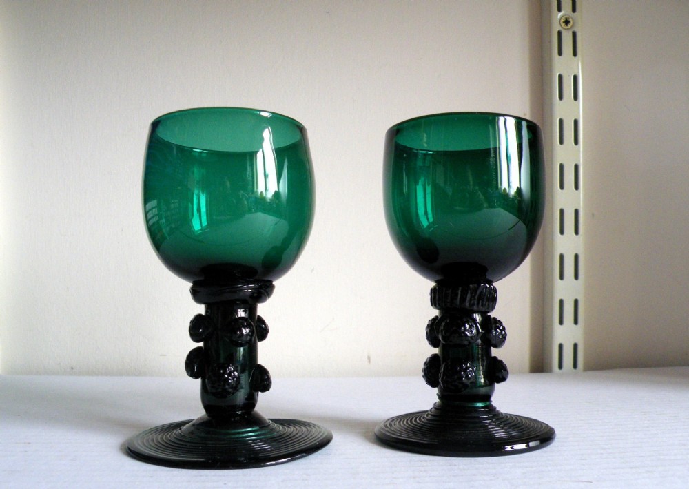 a fine pair of 18th century english hand made green glass roemers