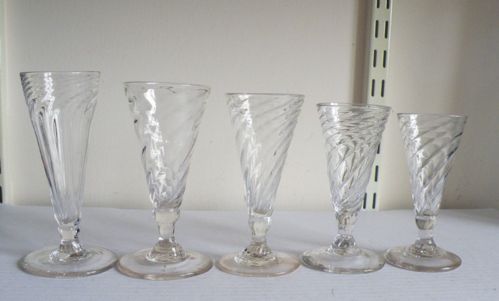 a graduated harlequin collection of five georgian wrythen dwarf ale glasses