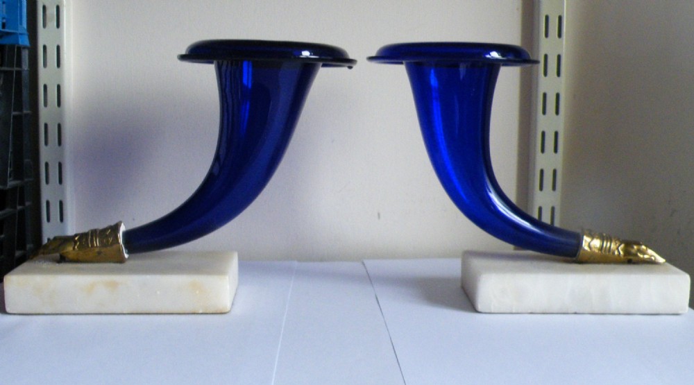 a fine pair of regency bristol blue glass cornucopia on marble bases circa 1820