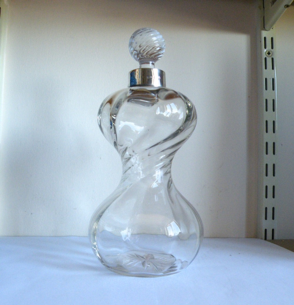 an unusual 1915 george v silver mounted glass decanter