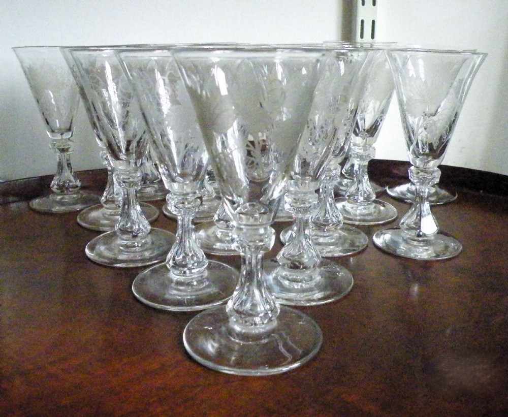 a wonderful rare set of 17 regency engraved wine glasses