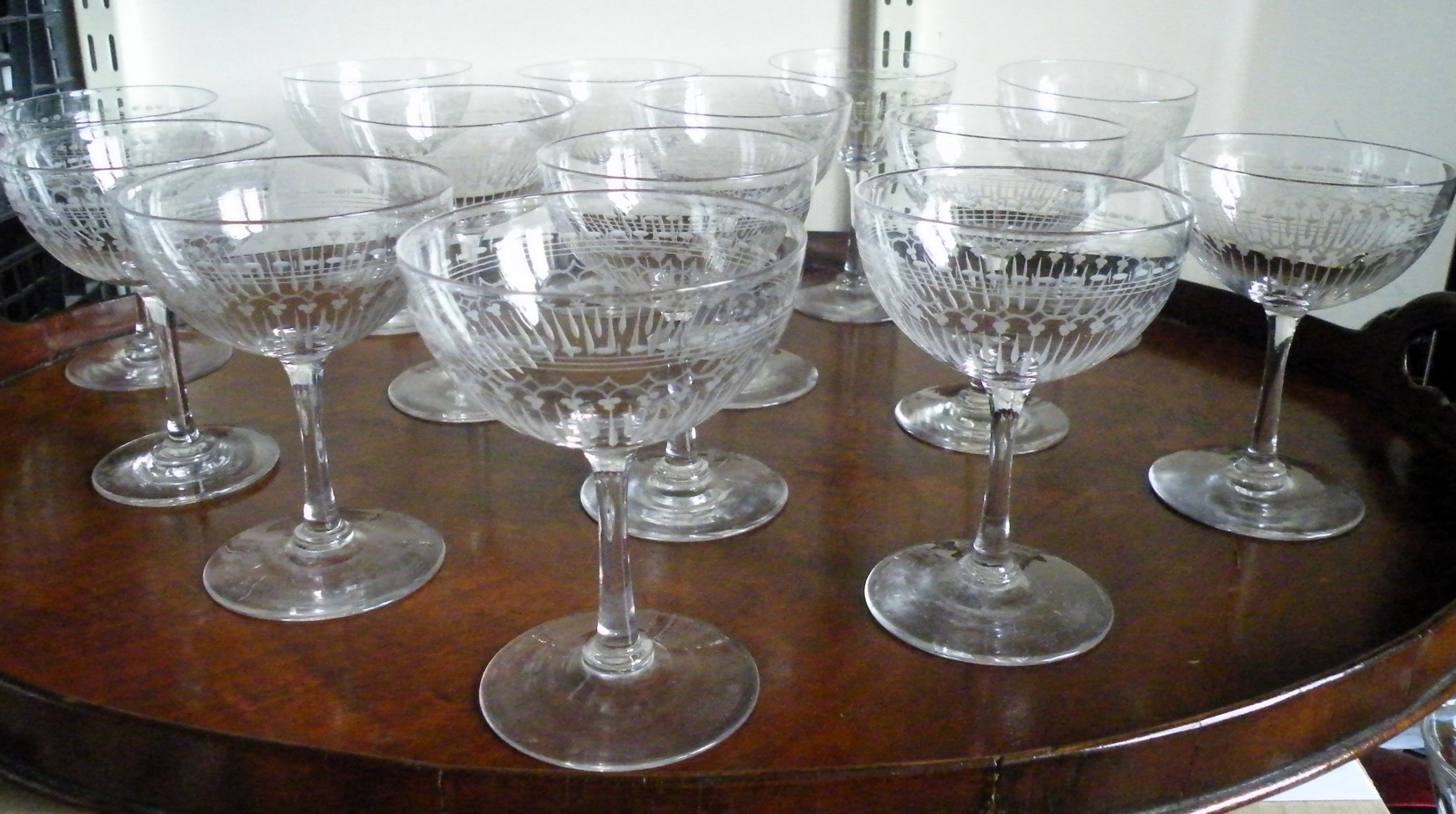 a fine and rare set of 14 victorian champagne glasses coupes