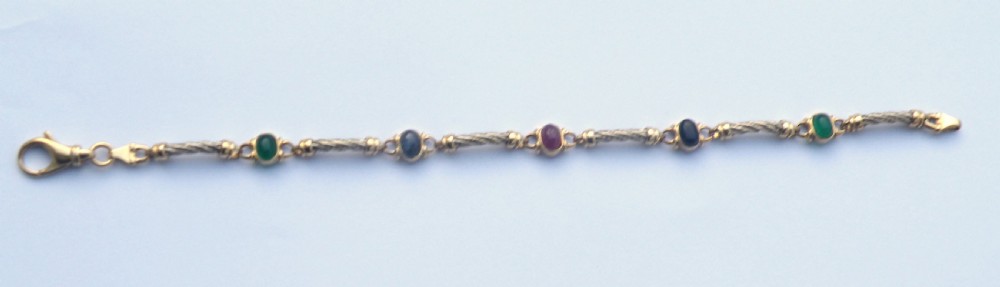 a pretty 9ct gold gem set bracelet