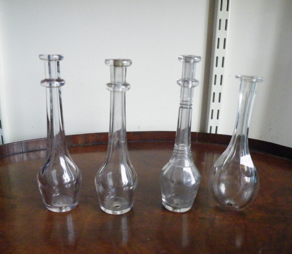 four 19th century glass toddy lifters