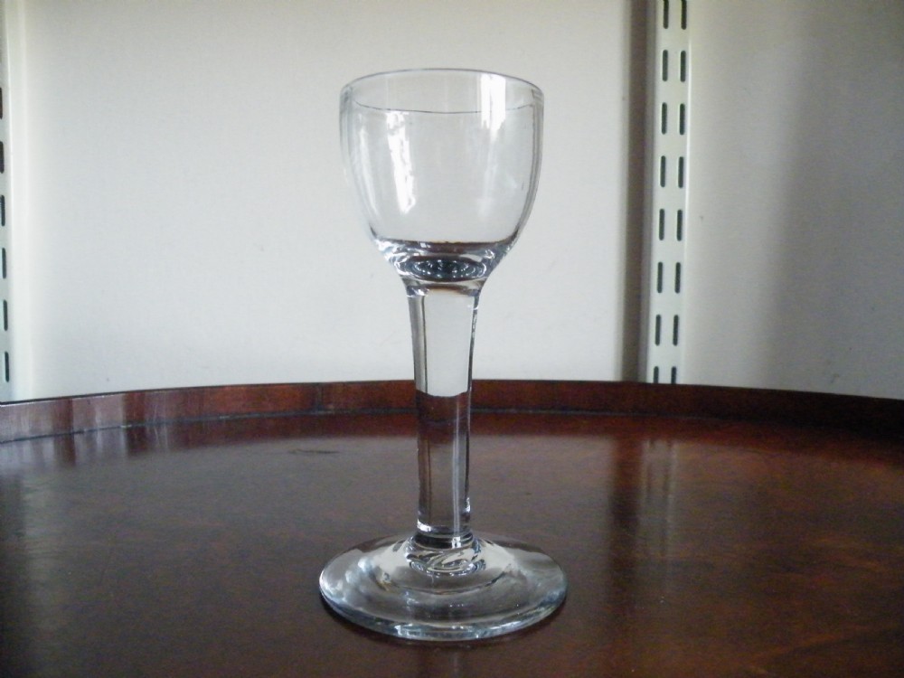 an 18th century plain stem cordial glass