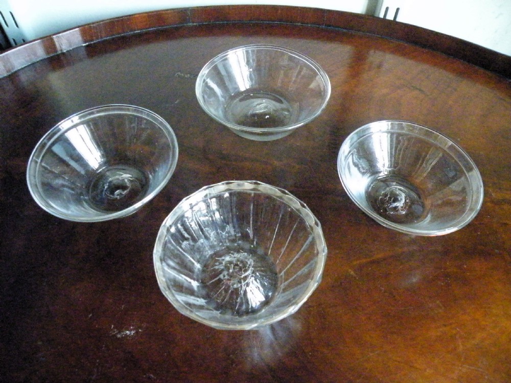 four 18th century glass patty pans