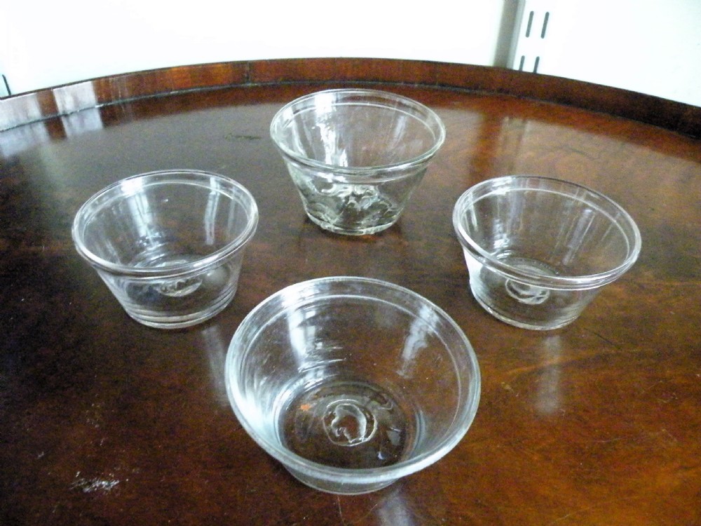 four 18th century glass patty pans